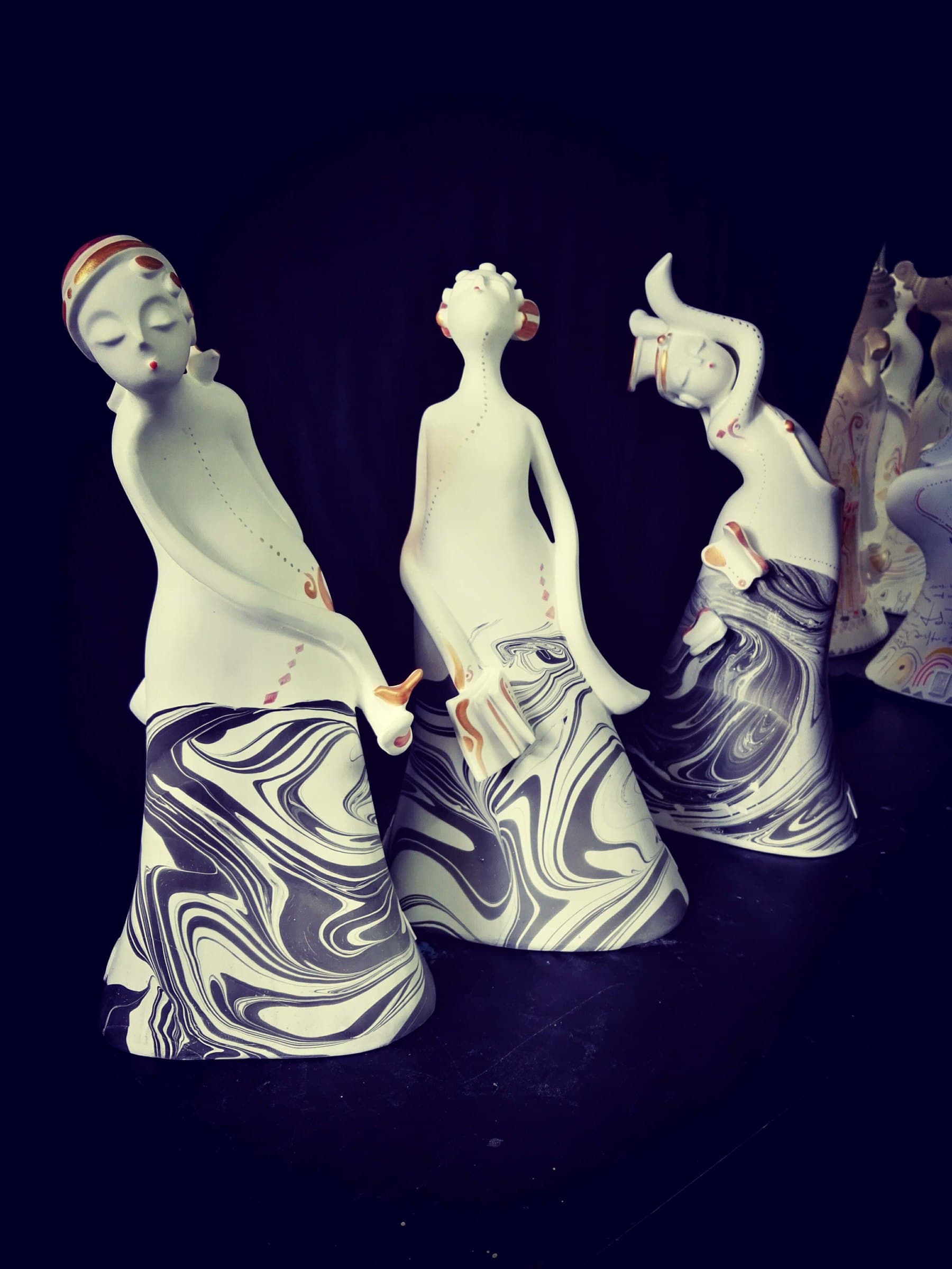 Twelve Beauties — three ceramic figures with marbled glaze