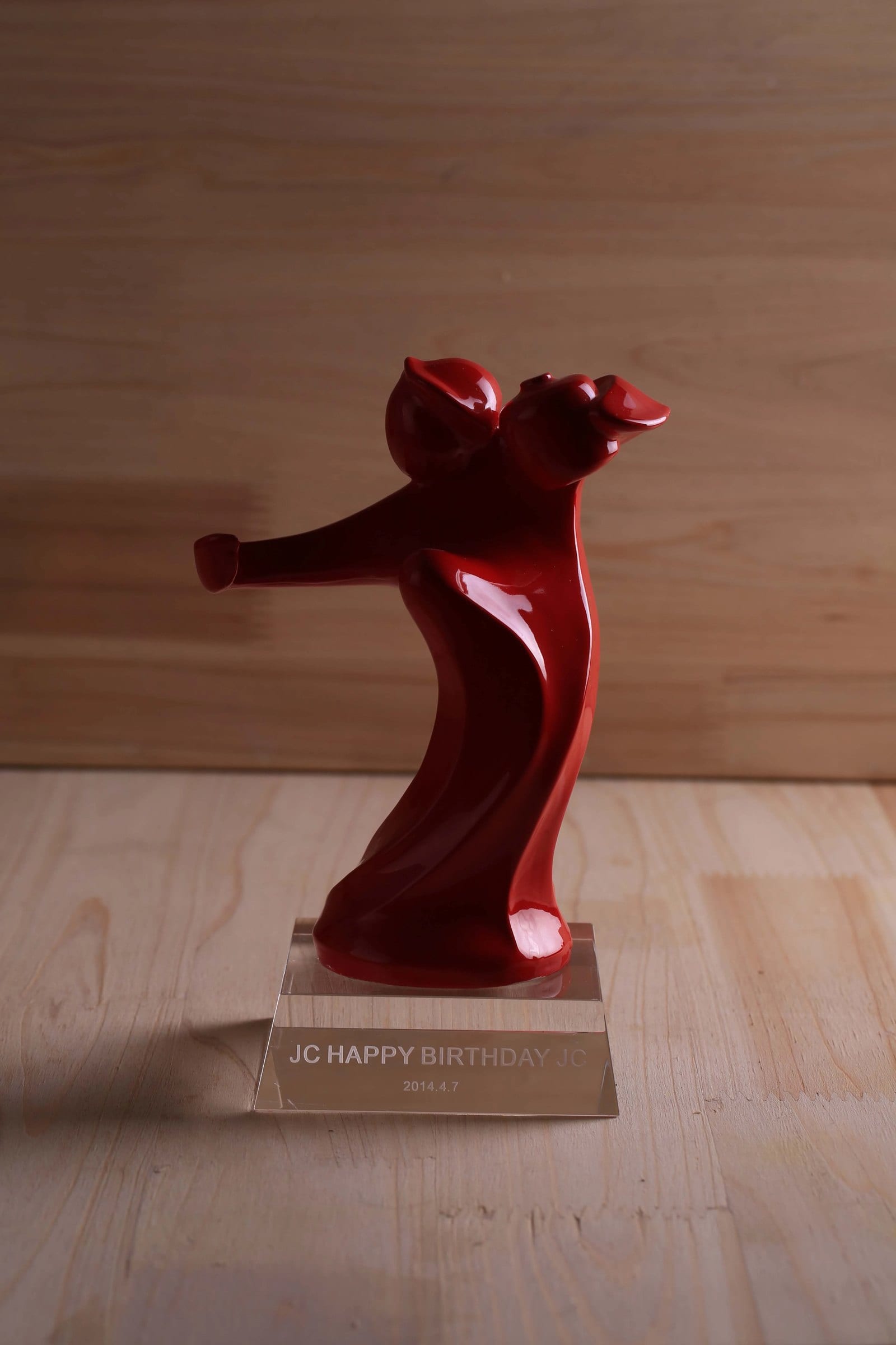 Dragon Drunk Red — lacquer-red figure on a wooden base