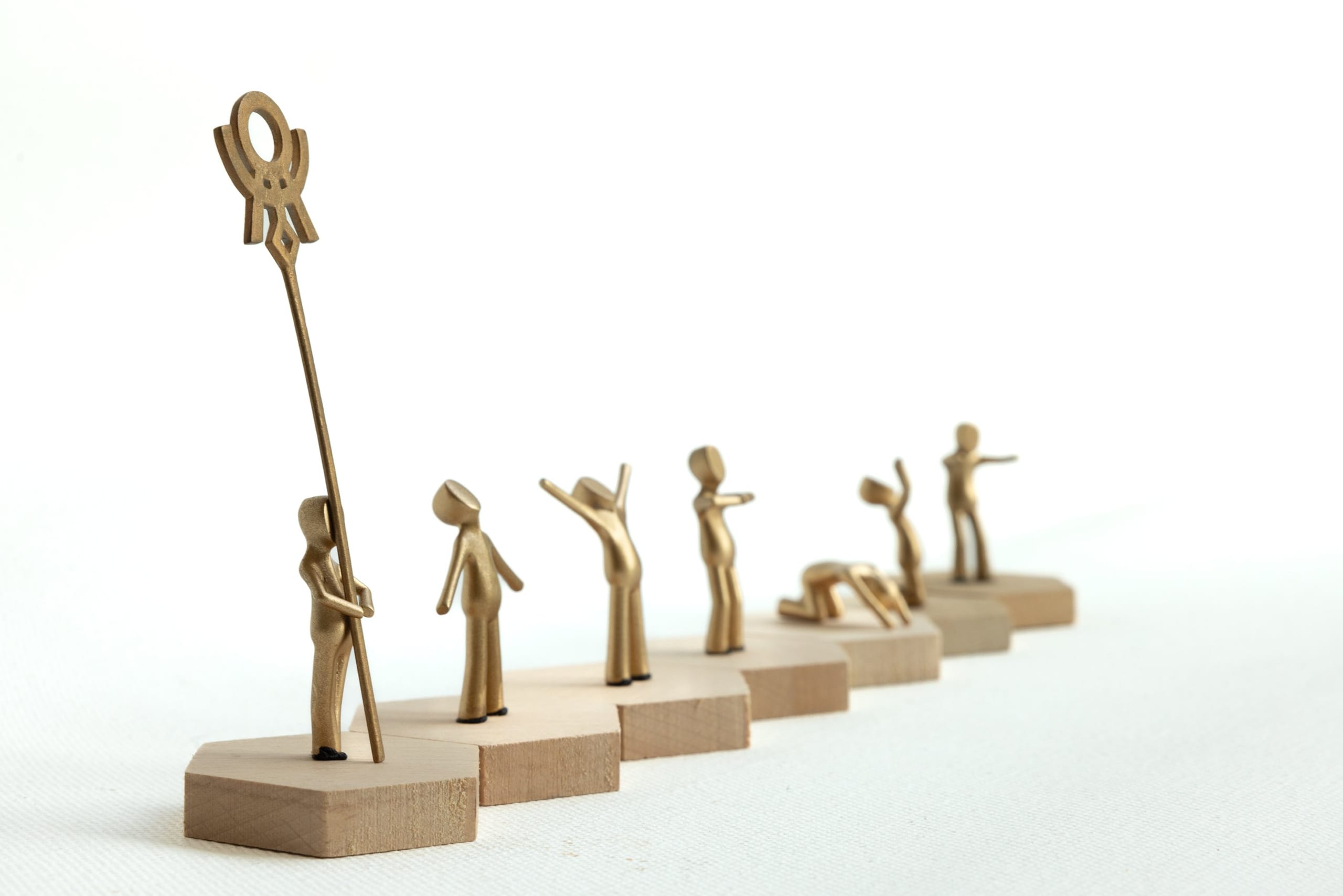 Figure studies with a ceremonial staff