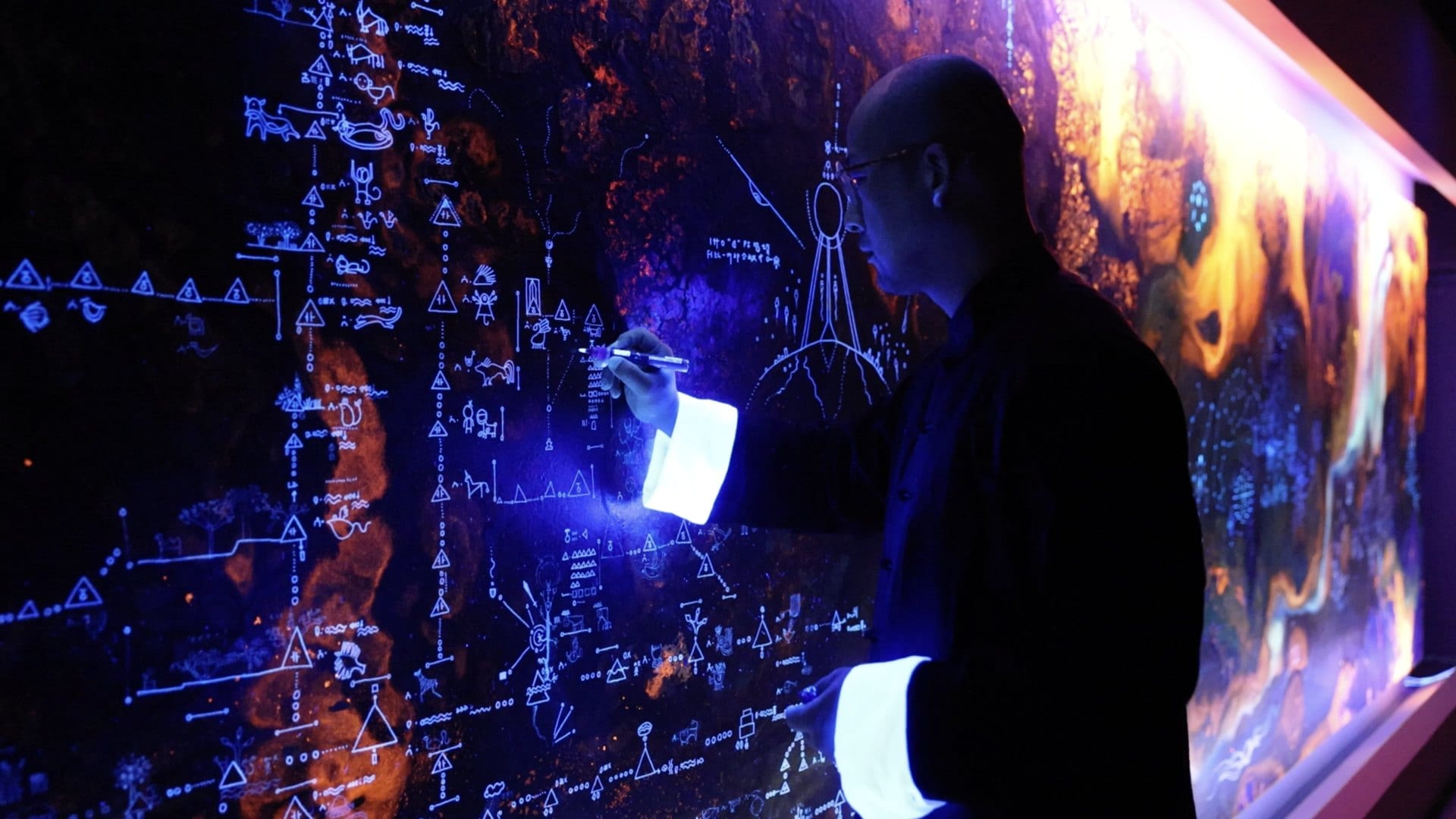 The artist reading the hidden world of the Shanhai Map under ultraviolet light