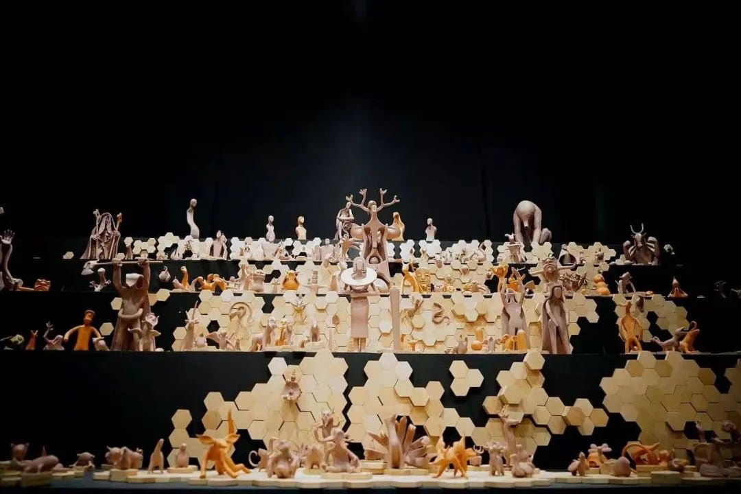 Shanhai World — figures on hexagonal terraces in the dark